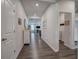 Bright hallway with hardwood floors, modern lighting, and easy access to the laundry room at 34 Mountainbrook Nw Dr, Cartersville, GA 30121