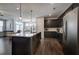 Spacious kitchen featuring a granite island, stainless steel appliances, and an open layout to the living and dining areas at 34 Mountainbrook Nw Dr, Cartersville, GA 30121
