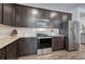 Modern kitchen features dark cabinets, stainless steel appliances, and granite countertops at 34 Mountainbrook Nw Dr, Cartersville, GA 30121