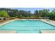 Inviting swimming pool with clear blue water and a diving board at 34 Mountainbrook Nw Dr, Cartersville, GA 30121