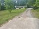 Charming ranch home with a long driveway and inviting front yard at 4734 Lawrenceville Hwy, Tucker, GA 30084