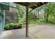 A view of the backyard showcasing the lush green lawn and shade trees at 855 Cedar Bluff Ct, Marietta, GA 30062