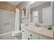 Hall bathroom features a shower over bath, sink with vanity, and white door at 855 Cedar Bluff Ct, Marietta, GA 30062