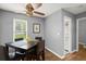 Cozy dining area featuring a dark wood table set, hardwood floors and a window with natural light at 855 Cedar Bluff Ct, Marietta, GA 30062