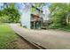 Multi-story home with an inviting elevated deck and a convenient garage, set in a wooded area at 855 Cedar Bluff Ct, Marietta, GA 30062