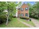 Inviting brick home with classic black shutters and a well-manicured lawn and garden at 855 Cedar Bluff Ct, Marietta, GA 30062