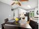 Eat-in kitchen that includes white cabinets, tile backsplash, modern appliances, hardwood floors, and a window at 855 Cedar Bluff Ct, Marietta, GA 30062