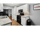Well-lit kitchen features stainless steel appliances, modern countertops, and wooden floor at 855 Cedar Bluff Ct, Marietta, GA 30062