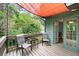 This patio features outdoor furniture, privacy shade, and views of the lush green yard at 855 Cedar Bluff Ct, Marietta, GA 30062