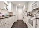 Efficient kitchen featuring white cabinetry, dark countertops, and modern appliances at 1111 Clairemont Ave # 5, Decatur, GA 30030