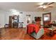 Cozy living room featuring hardwood floors, a ceiling fan, and vintage decor at 1111 Clairemont Ave # 5, Decatur, GA 30030