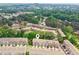 Aerial view of a townhouse community surrounded by lush greenery and trees at 1327 Rosen Rd, Brookhaven, GA 30319