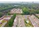 A high-angle view shows townhomes, a community pool, and downtown Atlanta in the background at 1327 Rosen Rd, Brookhaven, GA 30319