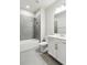 Bathroom features white vanity and tub/shower combo with modern gray tile at 1327 Rosen Rd, Brookhaven, GA 30319