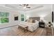 Serene bedroom with tray ceilings, neutral decor, and large windows offering scenic views at 1327 Rosen Rd, Brookhaven, GA 30319