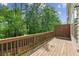 Wood deck surrounded by mature trees and landscaping offers privacy at 1327 Rosen Rd, Brookhaven, GA 30319