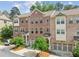 Charming brick townhome featuring a two-car garage and well-maintained landscaping at 1327 Rosen Rd, Brookhaven, GA 30319