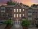 Charming brick townhome featuring a two-car garage and well-maintained landscaping at 1327 Rosen Rd, Brookhaven, GA 30319