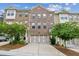 Charming brick townhome featuring a two-car garage and well-maintained landscaping at 1327 Rosen Rd, Brookhaven, GA 30319