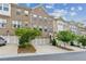 Charming brick townhome featuring a two-car garage and well-maintained landscaping at 1327 Rosen Rd, Brookhaven, GA 30319