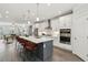 Open kitchen features a large island with seating, stainless steel appliances, and access to the living room at 1327 Rosen Rd, Brookhaven, GA 30319