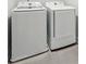 Modern laundry room with brand new Samsung washer and dryer on tile floors at 1327 Rosen Rd, Brookhaven, GA 30319