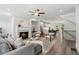 Bright, open-concept living room with a fireplace and an open kitchen view at 1327 Rosen Rd, Brookhaven, GA 30319