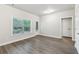Bright room features wood-look floors, a window, and access to the outdoors at 1327 Rosen Rd, Brookhaven, GA 30319