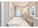 Bright bathroom with a soaking tub and neutral color scheme at 1419 Coretta Bnd, Atlanta, GA 30318