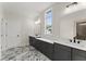 Bathroom features double vanities, modern lighting, and elegant marble-look floors at 1419 Coretta Bnd, Atlanta, GA 30318