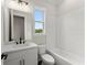 Bathroom with white subway tile surround and a black faucet against a white vanity at 1419 Coretta Bnd, Atlanta, GA 30318