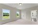 Serene bedroom with carpet, large windows, and a glimpse into the en suite bathroom at 1419 Coretta Bnd, Atlanta, GA 30318