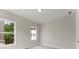 Cozy bedroom with neutral walls and carpet, featuring a bright window view at 1419 Coretta Bnd, Atlanta, GA 30318
