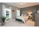 Cozy bedroom featuring carpet, natural light and an accent wall at 1419 Coretta Bnd, Atlanta, GA 30318