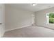 Spacious bedroom featuring neutral carpet, natural light, and a serene atmosphere, ideal for relaxation at 1419 Coretta Bnd, Atlanta, GA 30318