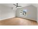 Bedroom with hardwood floors, large window, and a ceiling fan providing great lighting and air circulation at 1419 Coretta Bnd, Atlanta, GA 30318