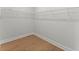 Walk-in closet with wire shelving and hardwood flooring provides efficient storage solutions at 1419 Coretta Bnd, Atlanta, GA 30318