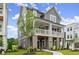 Stylish two-story home shows a side view with a gray exterior and manicured lawn at 1419 Coretta Bnd, Atlanta, GA 30318