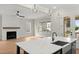 Kitchen has quartz counters, a farmhouse sink, a black island, and access to the outside at 1419 Coretta Bnd, Atlanta, GA 30318