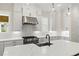 Well-appointed kitchen with stainless appliances, subway tile backsplash, and modern pendant lighting at 1419 Coretta Bnd, Atlanta, GA 30318