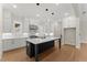Bright kitchen featuring white cabinets, quartz countertops, stainless steel appliances and a kitchen island at 1419 Coretta Bnd, Atlanta, GA 30318