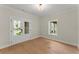The living room features hardwood floors, light walls and French doors to the exterior at 1419 Coretta Bnd, Atlanta, GA 30318