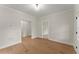 Bright, open room with hardwood floors and neutral wall paint at 1419 Coretta Bnd, Atlanta, GA 30318
