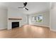 Bright living room featuring a fireplace, hardwood floors and lots of natural light at 1419 Coretta Bnd, Atlanta, GA 30318