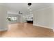 Spacious open-concept living area with hardwood floors flowing into the modern kitchen at 1419 Coretta Bnd, Atlanta, GA 30318
