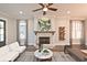 Cozy living room features a fireplace, stylish decor, and plenty of natural light at 1419 Coretta Bnd, Atlanta, GA 30318