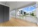Relaxing porch with wood flooring, white railings, and neighborhood views at 1419 Coretta Bnd, Atlanta, GA 30318