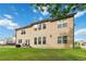 Expansive backyard featuring a well-maintained lawn and a charming outdoor seating area at 1934 Acorn Ln, Dacula, GA 30019