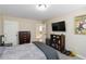 Bedroom with dresser, television and comic book art at 1934 Acorn Ln, Dacula, GA 30019