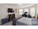 Bedroom boasts a TV, comic book art, and study desk at 1934 Acorn Ln, Dacula, GA 30019